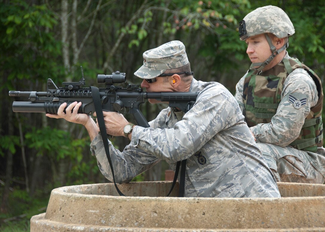 Major James Blanton, Commander of the 134th Security Forces Squadron trains with the M203 grenade launcher at Arnold AFB, Tullahoma TN on May 17, 2011. The Security Forces Squadron spent three days training on entry tactics, heavy weapons, and requalifying on the Beretta M9 and M4 Carbine. (Air National Guard photo by Staff Sergeant Scott Hollis/Released)