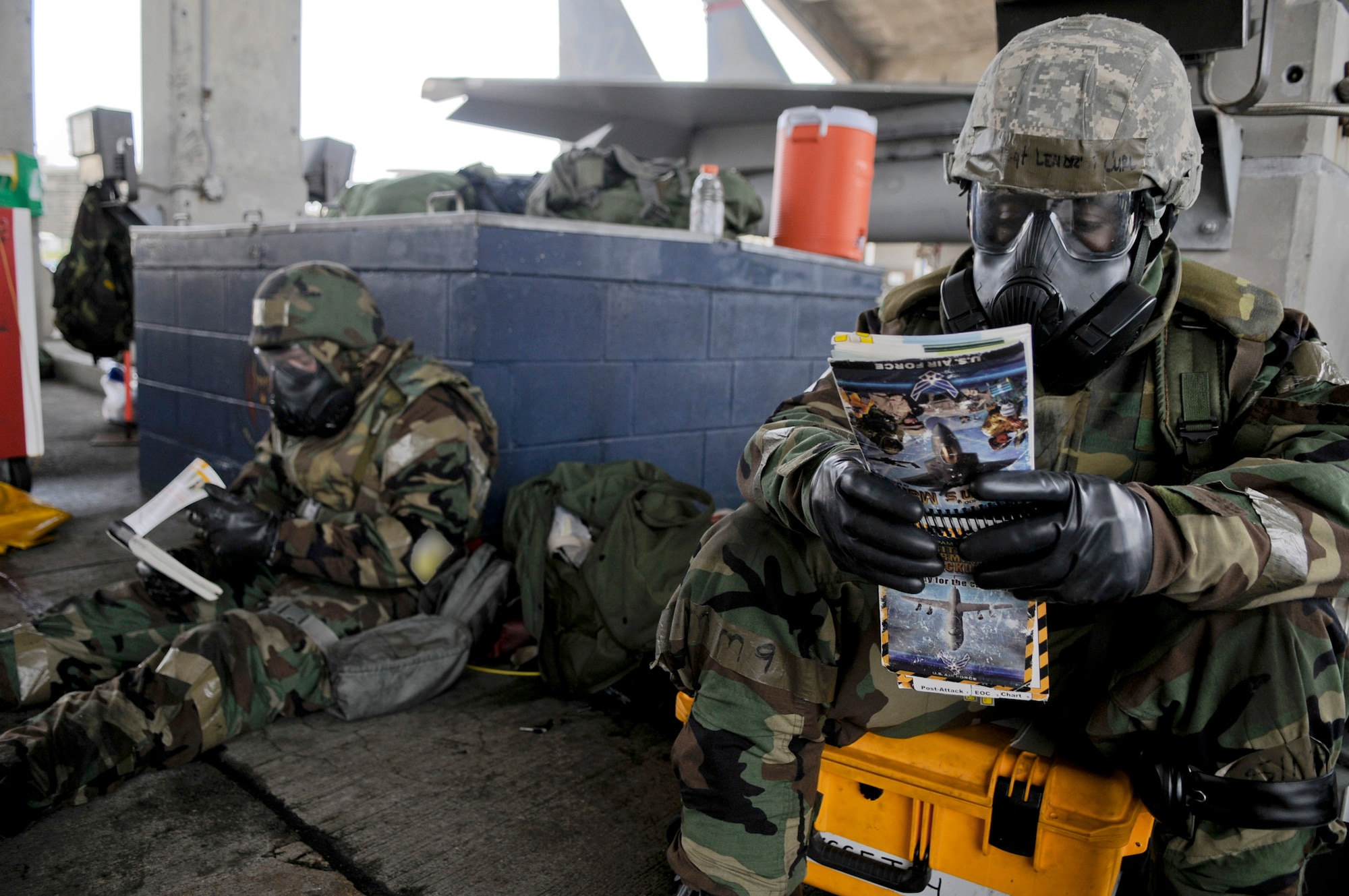 Tech. Sgt. Lendrea Curl (right) and Airman 1st Class Kevin Buff consult their Airman’s Manuals during Beverly High, May 19, 2011, at Kadena Air Base, Japan. Sergeant Curl is assigned to the 18th Aircraft Maintenance Squadron. Airman Buff is assigned to the 67th Aircraft Maintenance Unit. (U.S. Air Force photo/Airman 1st Class Maeson L. Elleman)
