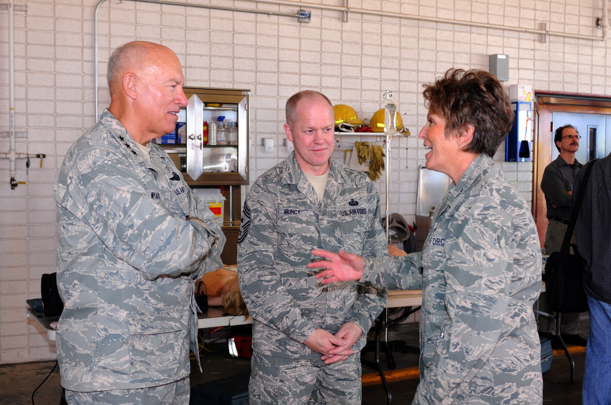 Retired Col. Karen Bence, former 162nd Mission Support Group commander, right, shows Lt. Gen. Harry M. Wyatt, Air National Guard director, and Air National Guard Command Chief Master Sgt. Christopher Muncy the base fighter station during a visit last year. Colonel Bence retired after 35 years of service this June. (U.S. Air Force photo/Maj. Gabe Johnson)