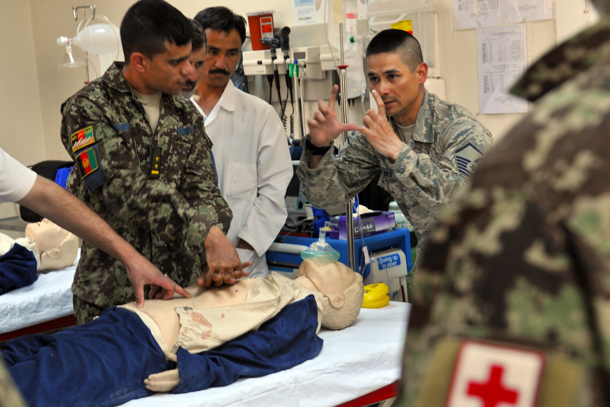 Master Sgt. Christopher Banks, a medical technician assigned to the 438th Air Expeditionary Wing, teaches a cardiopulmonary resuscitation class to a group of Afghan Air Force Airmen at the Afghan Air Base in Kabul, Afghanistan. Sergeant Banks, an air advisor with the 438th AEW, helps train the Afghan Air Force in the medical field.  (U.S. Air Force Photo by Tech. Sgt. Brian E. Christiansen).