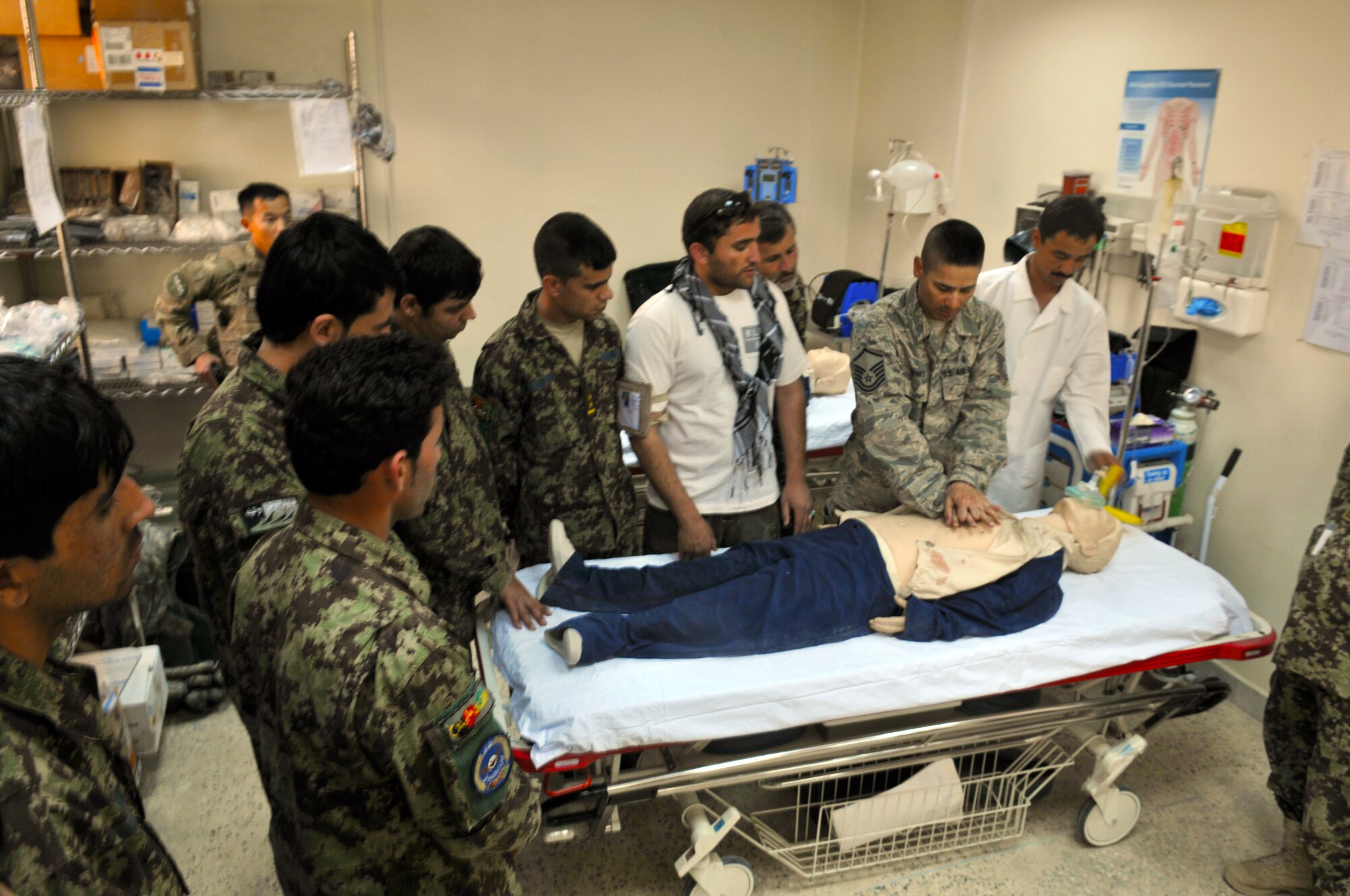Master Sgt. Christopher Banks, a medical technician assigned to the 438th Air Expeditionary Wing, teaches a cardiopulmonary resuscitation class to a group of Afghan Air Force Airmen at the Afghan Air Base in Kabul, Afghanistan. Sergeant Banks, an air advisor with the 438th AEW, helps train the Afghan Air Force in the medical field.  (U.S. Air Force Photo by Tech. Sgt. Brian E. Christiansen).