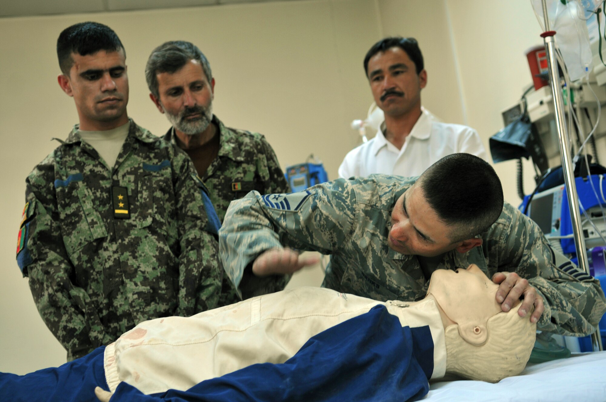 Master Sgt. Christopher Banks, a medical technician assigned to the 438th Air Expeditionary Wing, teaches a cardiopulmonary resuscitation class to a group of Afghan Air Force Airmen at the Afghan Air Base in Kabul, Afghanistan. Sergeant Banks, an air advisor with the 438th AEW, helps train the Afghan Air Force in the medical field.  (U.S. Air Force Photo by Tech. Sgt. Brian E. Christiansen).