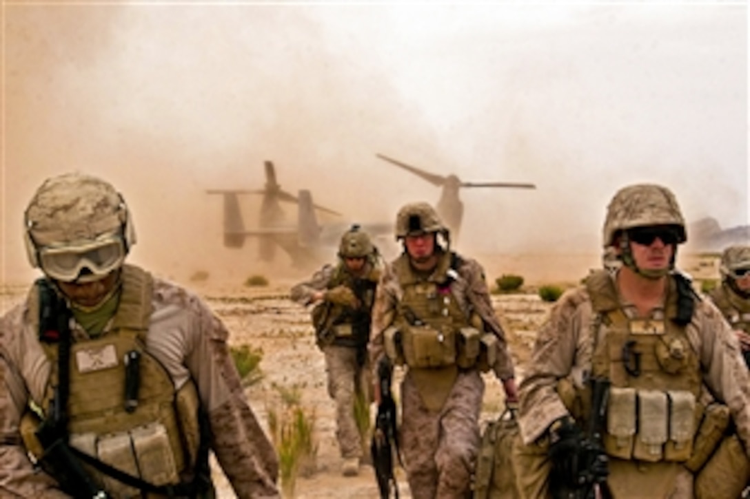 U.S. Marines arrive at the impact site with French soldiers to recover the wreckage of a French Mirage 2000 jet fighter aircraft northwest of Forward Operating Base Delaram in Afghanistan's Helmand province, May 25, 2011. The Marines are assigned to the Combat Logistics Battalion 8, 2nd Marine Logistics Group Forward.