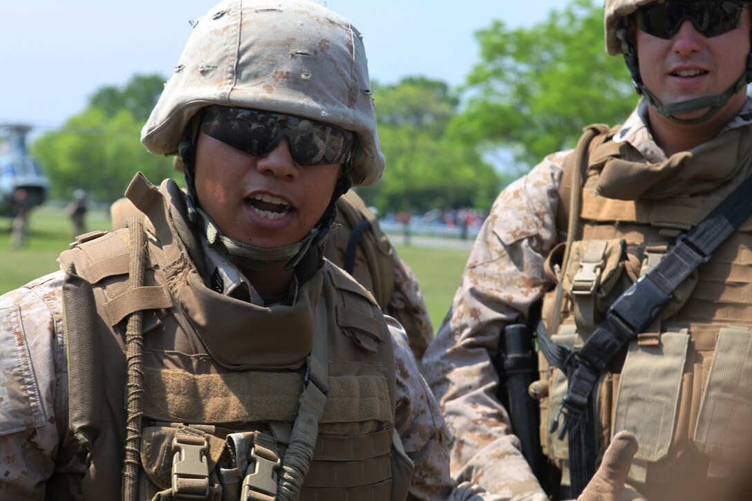 Sgt. Jamie Balderrama, a squad leader with Fox Company, 2nd Battalion, 9th Marine Regiment, rallies the squad during a simulated raid at Orchard Beach, May 27, 2011.   Various units from II Marine Expeditionary Force and Marines Forces Reserve have organized under the 24th Marine Expeditionary Unit to form the Special Purpose Marine Air Ground Task Force - New York. The Marines embarked on the Navy's Amphibious Assault Ships, the USS Iwo Jima (LHD -7) and USS New York (LPD-21) to take part in Fleet Week New York 2011 from May 25 to June 1. The Marines will showcase the capabilities of the MAGTF, and also honor those who have served by participating in various events during the Memorial Day weekend.