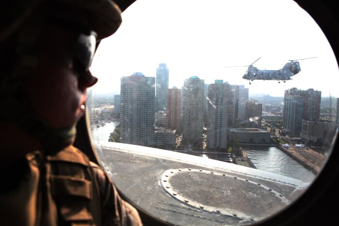 Lance Cpl. Trenton Holbrook, an infantryman with Fox Company, 2nd Battalion, 9th Marine Regiment, looks out at New York City from inside a CH-46 helicopter, May 27, 2011. Various units from II Marine Expeditionary Force and Marines Forces Reserve have organized under the 24th Marine Expeditionary Unit to form the Special Purpose Marine Air Ground Task Force - New York. The Marines embarked on the Navy's Amphibious Assault Ships, the USS Iwo Jima (LHD -7) and USS New York (LPD-21) to take part in Fleet Week New York 2011 from May 25 to June 1. The Marines will showcase the capabilities of the MAGTF, and also honor those who have served by participating in various events during the Memorial Day weekend.