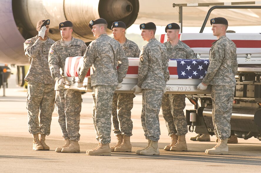 A U.S. Army carry team transfers the remains of Army Spc. Adam J. Patton, of Port Orchard, Wash., at Dover Air Force Base, Del., May 28, 2011. Patton was assigned to the 4th Battalion, 101st Aviation Regiment, 159th Combat Aviation Brigade, 101st Airborne Division (Air Assault), Fort Campbell, Ky. (U.S. Air Force photo/Roland Balik)