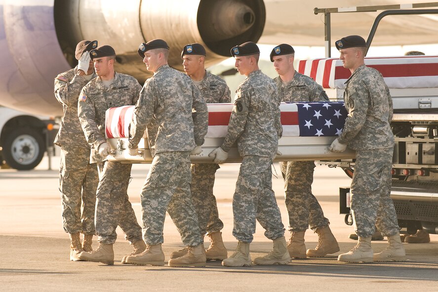 A U.S. Army carry team transfers the remains of Army Staff Sgt. Edward D. Mills Jr., of New Castle, Pa., at Dover Air Force Base, Del., May 28, 2011. Mills was assigned to the 4th Battalion, 101st Aviation Regiment, 159th Combat Aviation Brigade, 101st Airborne Division (Air Assault), Fort Campbell, Ky.
(U.S. Air Force photo/Roland Balik)