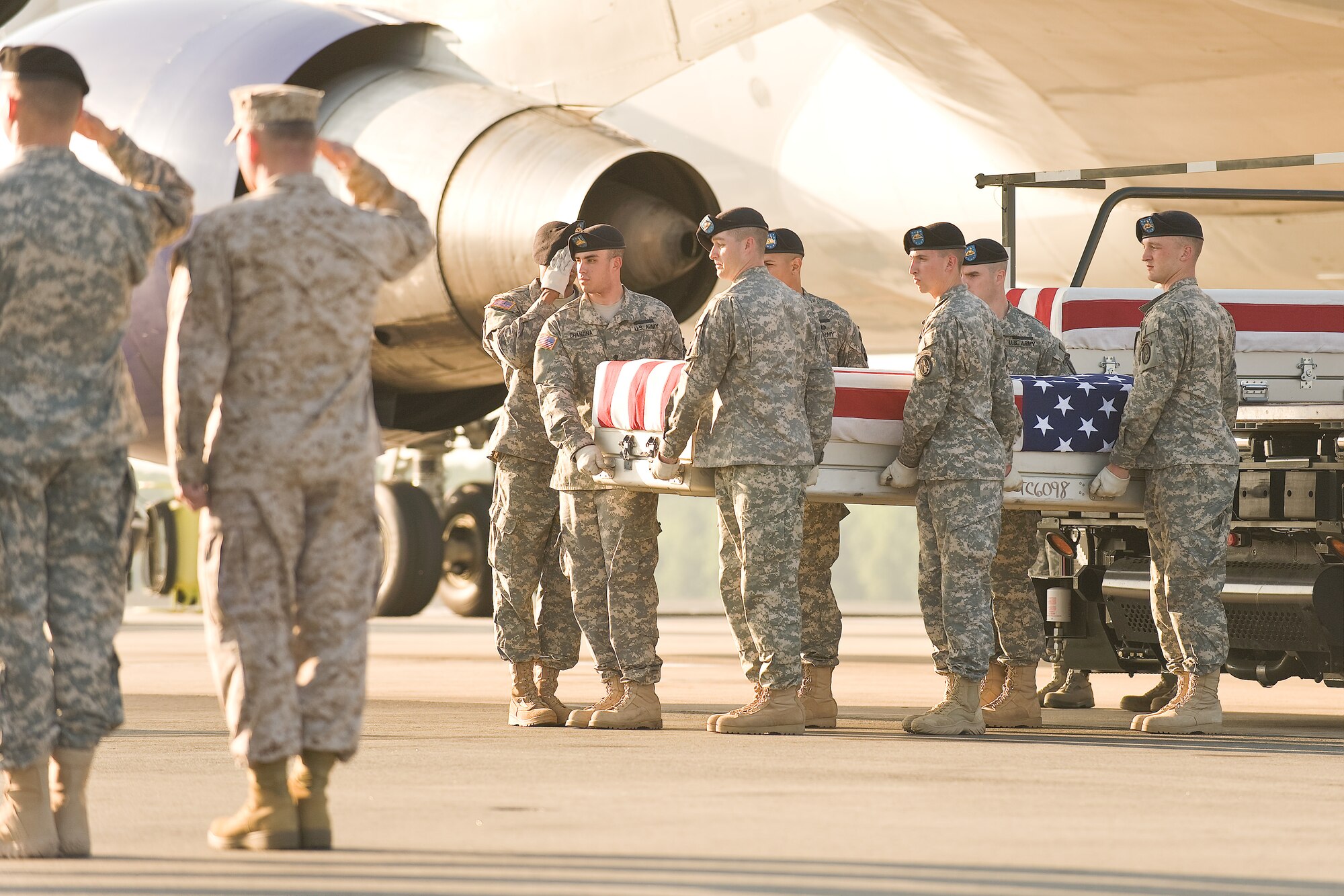 A U.S. Army carry team transfers the remains of Army 1st Lt. John M. Runkle, of West Salem, Ohio, at Dover Air Force Base, Del., May 28, 2011. Runkle was assigned to the 4th Battalion, 101st Aviation Regiment, 159th Combat Aviation Brigade, 101st Airborne Division (Air Assault), Fort Campbell, Ky. (U.S. Air Force photo/Roland Balik)