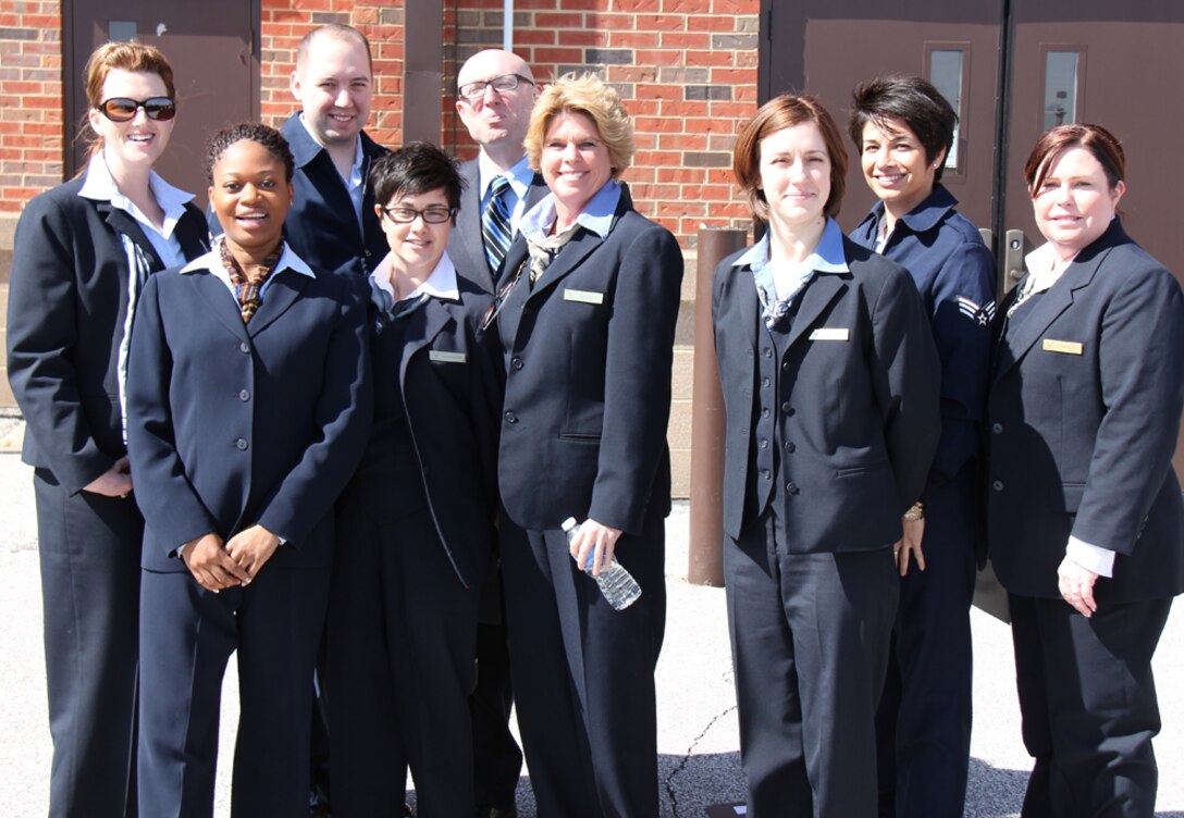 Flight attendants pause between training for a smile.  They take care of serving distinguished visitors on flights around the country and the world, during rewarding 932nd Airlift Wing missions, based at Scott Air Force Base.  (U.S. Air Force photo/Maj. Stan Paregien)