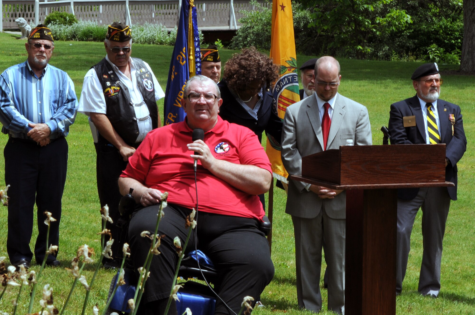 John Lewandowski, founder, president and CEO of the Disables Veterans Committee on Housing, and disabled veteran, gives an introduction for the U.S. Air Force Honor Guard Drill Team May 27 at the Historic Jordan Springs event and cultual centre, Jordan Springs, Va. Each banch of service was represented in the Memorial Day presentation. (U.S. Air Force photo by Airman 1st Class Tabitha N. Haynes)
