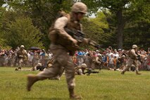 EAST MEADOW, N.Y. - Marines perform a helicopter raid at Eisenhower Park during Fleet Week New York 2011, May 28. The demonstration was held by Marines with the 24th Marine Expeditionary Unit as part of Fleet Week New York 2011. He is one of more than 3,000 Marines, sailors and Coast Guardsmen in the area participating in community events and demonstrations as part of Fleet Week. This is the 27th year New York has hosted the sea services for Fleet Week. (Official Marine Corps photo by Sgt. Randall A. Clinton / RELEASED)