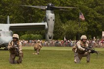 EAST MEADOW, N.Y. - Marines perform a helicopter raid at Eisenhower Park during Fleet Week New York 2011, May 28. The demonstration was held by Marines with the 24th Marine Expeditionary Unit as part of Fleet Week New York 2011. He is one of more than 3,000 Marines, sailors and Coast Guardsmen in the area participating in community events and demonstrations as part of Fleet Week. This is the 27th year New York has hosted the sea services for Fleet Week. (Official Marine Corps photo by Sgt. Randall A. Clinton / RELEASED)