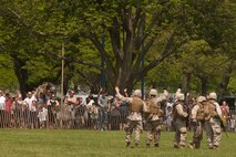 EAST MEADOW, N.Y. - Marines wave goodbye the crowd after a helicopter raid demonstration at Eisenhower Park during Fleet Week New York 2011, May 28. The demonstration was held by Marines with the 24th Marine Expeditionary Unit as part of Fleet Week New York 2011. He is one of more than 3,000 Marines, sailors and Coast Guardsmen in the area participating in community events and demonstrations as part of Fleet Week. This is the 27th year New York has hosted the sea services for Fleet Week. (Official Marine Corps photo by Sgt. Randall A. Clinton / RELEASED)