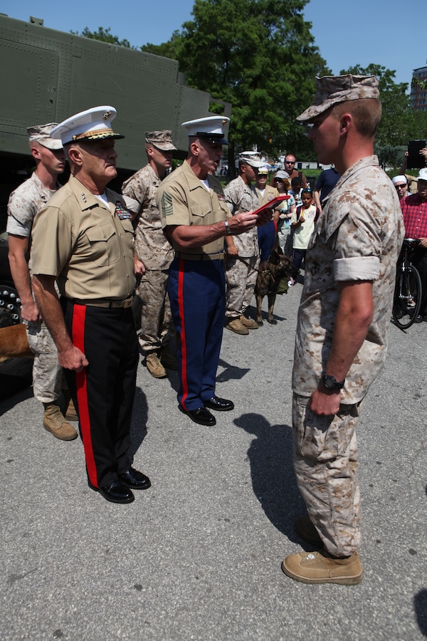 Lt. Gen. Dennis J. Hejlik, commander of Marine Forces Command (MARFORCOM), conducts a promotion ceremony for 2nd Lt. Michael Manson at Battery Park, May 28. Manson, from Scottsdale, Ariz., was promoted to first lieutenant during the ceremony.  Various units from II Marine Expeditionary Force and Marine Forces Reserve have organized under the 24th Marine Expeditionary Unit to form the Special Purpose Marine Air Ground Task Force - New York. The Marines embarked on the Navy's Amphibious Assault Ships, the USS Iwo Jima (LHD -7) and USS New York (LPD-21) to take part in Fleet Week New York 2011 from May 25 to June 1. The Marines will showcase the capabilities of the MAGTF, and also honor those who have served by participating in various events during the Memorial Day weekend.
