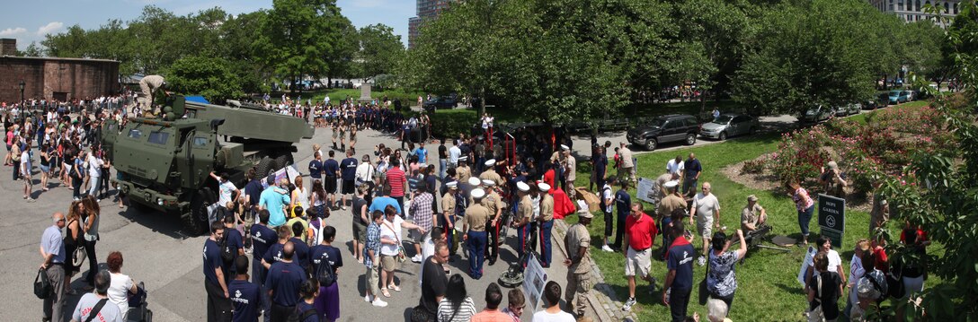 New Yorkers and tourists check out a number of static displays showcasing various Marine Corps assets at Battery Park, May 28. Various units from II Marine Expeditionary Force and Marines Forces Reserve have organized under the 24th Marine Expeditionary Unit to form the Special Purpose Marine Air Ground Task Force - New York. The Marines embarked on the Navy’s Amphibious Assault Ships, the USS Iwo Jima (LHD -7) and USS New York (LPD-21) to take part in Fleet Week New York 2011 from May 25 to June 1. The Marines will showcase the capabilities of the MAGTF, and also honor those who have served by participating in various events during the Memorial Day weekend. (Photo illustration)