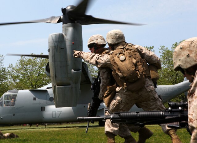 Marines with Fox Company, 2nd Battalion, 9th Marine Regiment , currently attached to the 24th Marine Expeditionary Unit,  maneuver off a V-22 Osprey during a simulated raid at Eisenhower Park , May 28, 2011. Various units from II Marine Expeditionary Force and Marine Forces Reserve have organized under the 24th Marine Expeditionary Unit to form the Special Purpose Marine Air Ground Task Force - New York. The Marines embarked on the Navy's Amphibious Assault Ships, the USS Iwo Jima (LHD -7) and USS New York (LPD-21) to take part in Fleet Week New York 2011 from May 25 to June 1. The Marines will showcase the capabilities of the MAGTF, and also honor those who have served by participating in various events during the Memorial Day weekend.