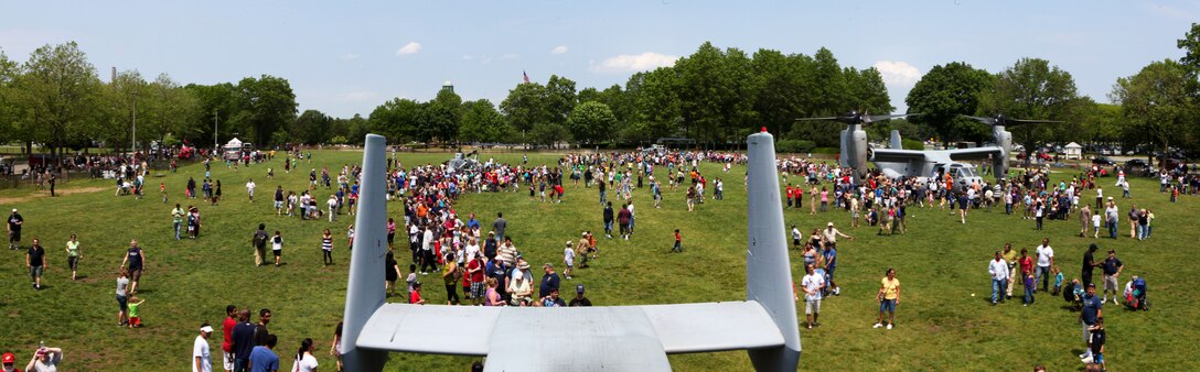 New Yorkers and tourists gather to see Marines and V-22 Ospreys after a simulated raid at Eisenhower Park , May 28, 2011. Various units from II Marine Expeditionary Force and Marine Forces Reserve have organized under the 24th Marine Expeditionary Unit to form the Special Purpose Marine Air Ground Task Force - New York. The Marines embarked on the Navy's Amphibious Assault Ships, the USS Iwo Jima (LHD -7) and USS New York (LPD-21) to take part in Fleet Week New York 2011 from May 25 to June 1. The Marines will showcase the capabilities of the MAGTF, and also honor those who have served by participating in various events during the Memorial Day weekend. (Photo illustration)