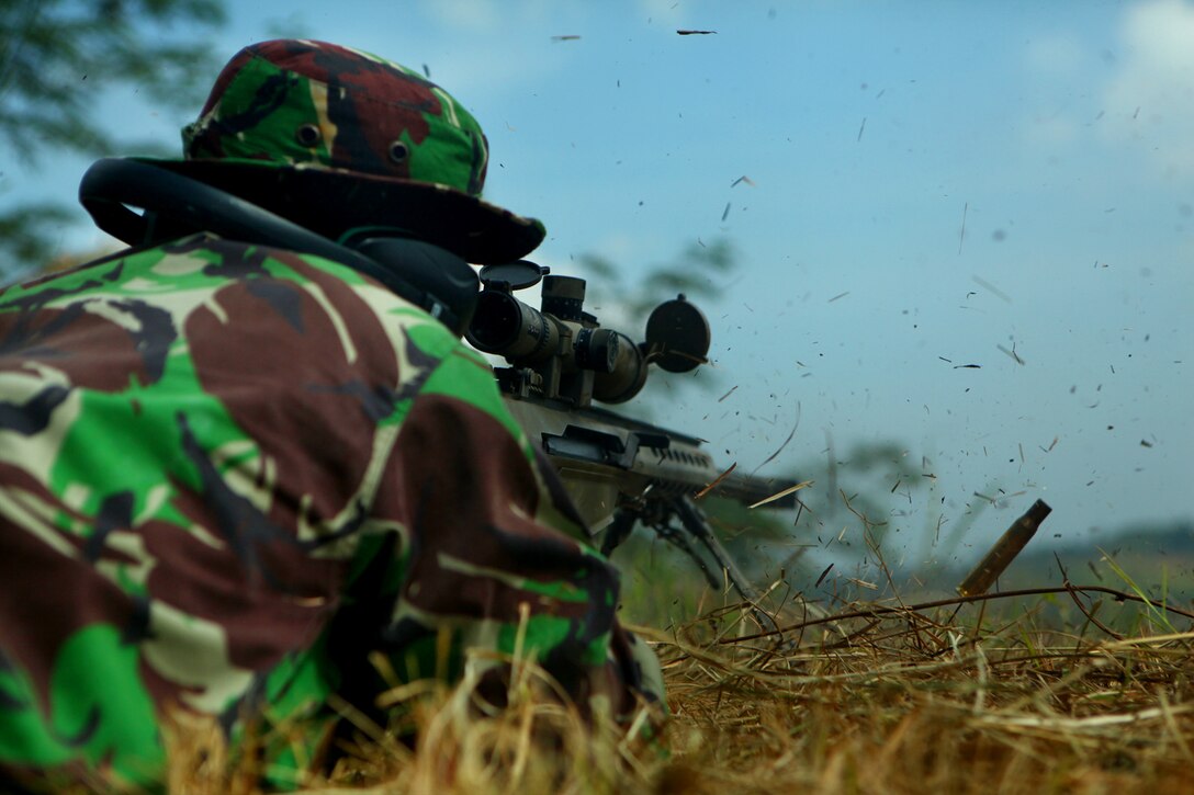 An Indonesian Marine fires an M-82 Special Application Scoped Rifle during sniper training with U.S. Marines of Landing Force Company May 29. During the sniper training, U.S. and Indonesian Marines learned to operate the weapon systems of one another. Landing Force Company is participating in Cooperation Afloat Readiness and Training (CARAT) 2011. CARAT is an annual series of bilateral exercises held between the U.S. and Southeast Asian nations with the goals of enhancing regional cooperation, promoting mutual trust and understanding, and increasing operational readiness. While in Indonesia, the service members from both nations train together on martial arts, military operations on urban terrain, jungle warfare, combat marksmanship and combat lifesaving.