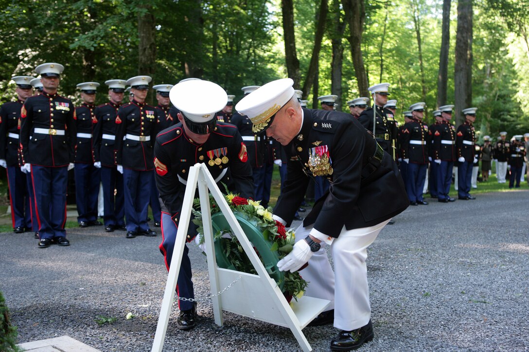 The 35th Commandant of the Marine Corps General James F. Amos lays a wreath in front of the Iron Mike monument atop a hill in the heart of the Belleau Wood forest during a private Memorial Day ceremony in front of a formation of Marines and French soldiers. The Iron Mike monument was sculpted by Felix Weihs de Weldon, the artist who later designed the Marine Corps War Memorial in Washington, D.C., and was erected in honor of the 5th and 6th Marine Regiments after World War I. (Marine Corps photo by Master Sgt. Grady T. Fontana)