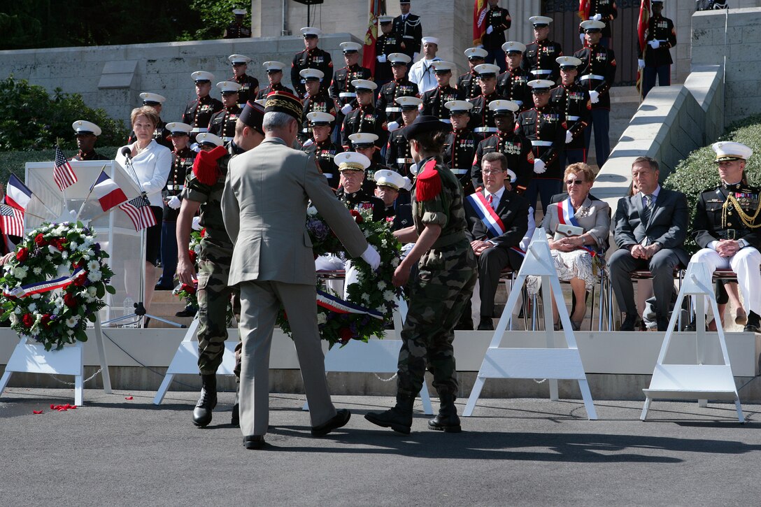 French Commander of Land Forces Lt. Gen. Herve Charpentier lays a wreath during a Memorial Day ceremony here at the foot of the steps that lead to the chapel at the Aisne-Marne American Cemetery in front of dignitaries and a formation of Marines from 5th and 6th Marine Regiments. More than 2,000 French and American visitors attended the Memorial Day ceremony here. (Marine Corps photo by Master Sgt. Grady T. Fontana)