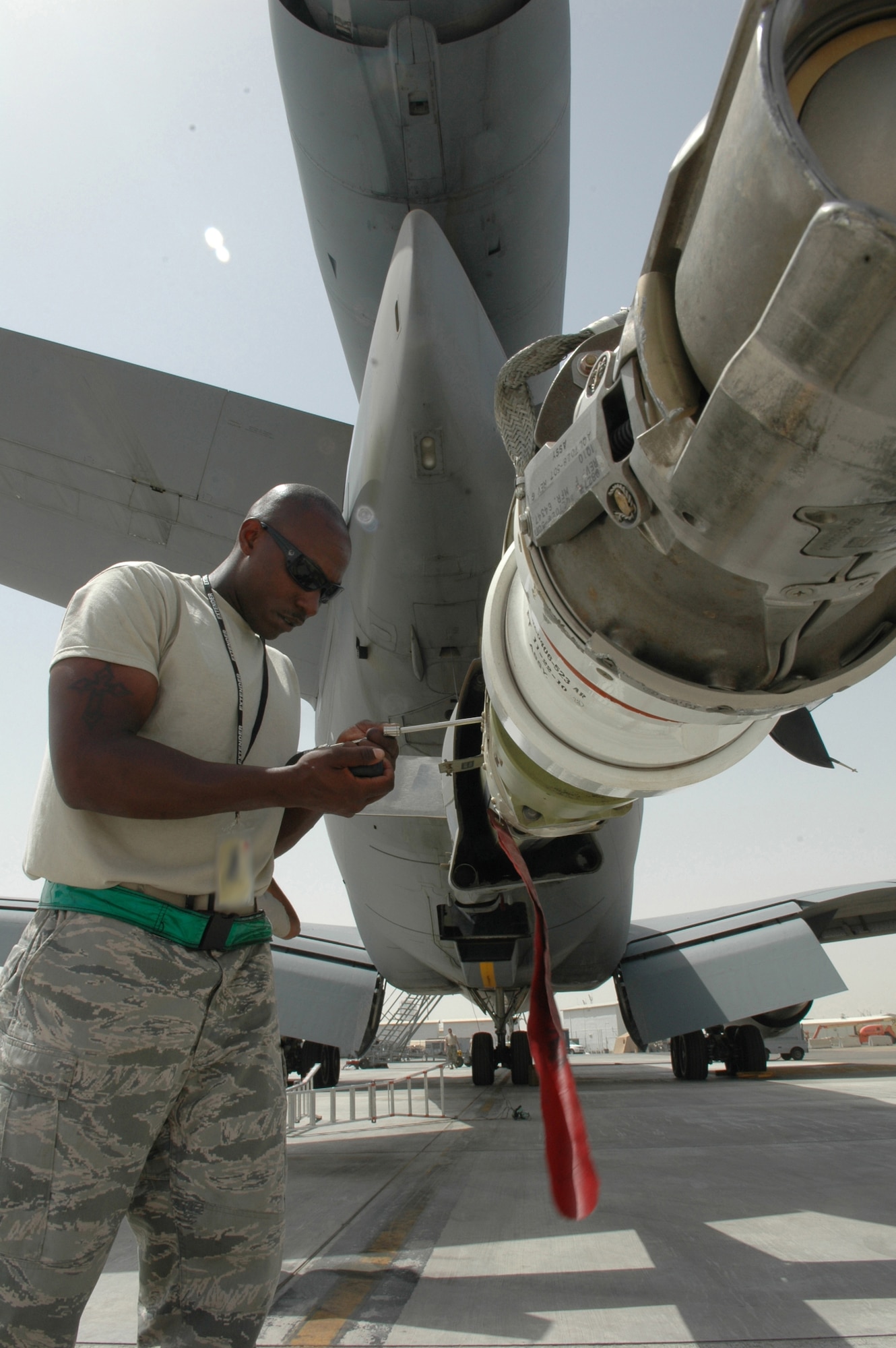 Staff Sgt. Aaron Whiteside, 380th Expeditionary Aircraft Maintenance Squadron for the KC-10 Extender, performs maintenance checks on the boom April 18, 2011, in Southwest Asia. Sergeant Whiteside is deployed from 605th AMXS, McGuire AFB, N.J. (U.S. Air Force photo by Master Sgt. Julie Briden-Garcia)