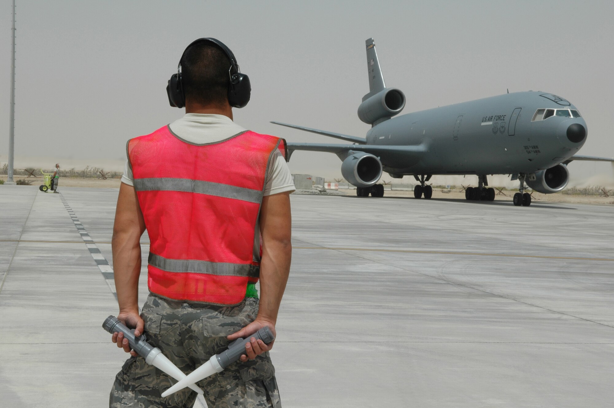 Airman 1st Class Gene Meredith, 380th Expeditionary Aircraft Maintenance Squadron KC-10 crew chief, prepares to launch the Extender in Southwest Asia. The KC-10 Extender is an Air Mobility Command advanced tanker and cargo aircraft designed to provide increased global mobility for U.S. armed forces. Airman Meredith is deployed from 605th AMXS, McGuire AFB, N.J. (U.S. Air Force photo by Master Sgt. Julie Briden-Garcia)