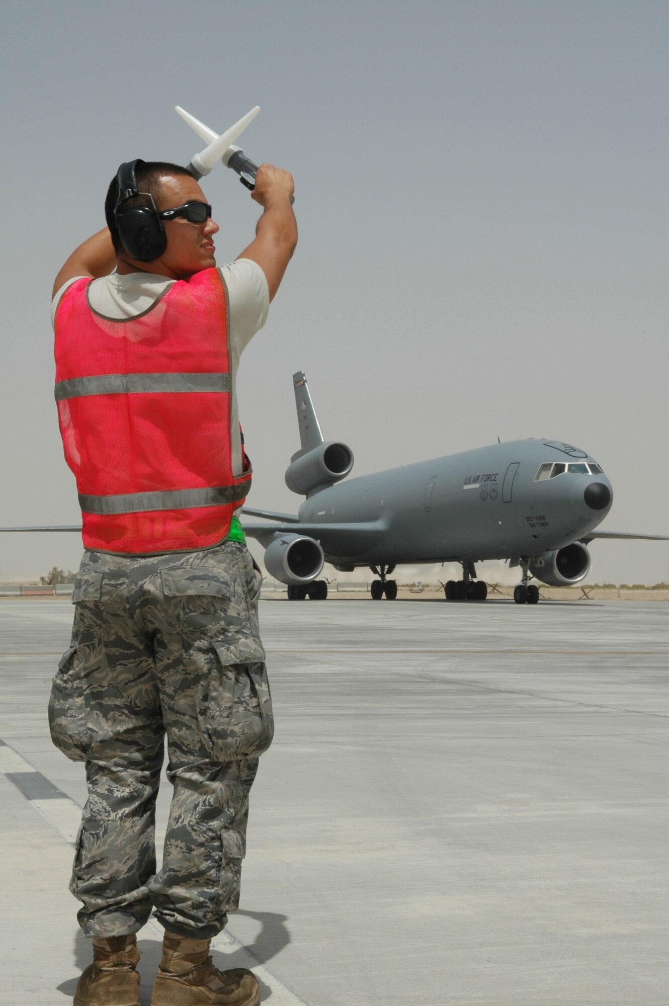 Airman 1st Class Gene Meredith, 380th Expeditionary Aircraft Maintenance Squadron KC-10 crew chief, prepares to launch the Extender in Southwest Asia. The KC-10 Extender is an Air Mobility Command advanced tanker and cargo aircraft designed to provide increased global mobility for U.S. armed forces. Airman Meredith is deployed from 605th AMXS, McGuire AFB, N.J. (U.S. Air Force photo by Master Sgt. Julie Briden-Garcia)