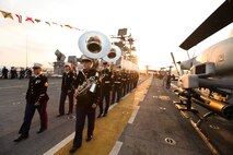NEW YORK -- Marines from the Marine Forces Reserve Band perform for guests on USS Iwo Jima while docked here, May 30, as part of the Sunset Parade. More than 3,000 Marines, Sailors and Coast Guardsmen in the area participating in community outreach events and equipment demonstrations as part of Fleet Week New York 2011. This is the 27th year New York has hosted the sea services for Fleet Week. (Official Marine Corps photo by Sgt. Jimmy D. Shea / RELEASED)