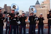 NEW YORK -- Marines from the Marine Forces Reserve Band perform for guests on USS Iwo Jima while docked here, May 30, as part of the Sunset Parade. More than 3,000 Marines, Sailors and Coast Guardsmen in the area participating in community outreach events and equipment demonstrations as part of Fleet Week New York 2011. This is the 27th year New York has hosted the sea services for Fleet Week. (Official Marine Corps photo by Sgt. Jimmy D. Shea / RELEASED)