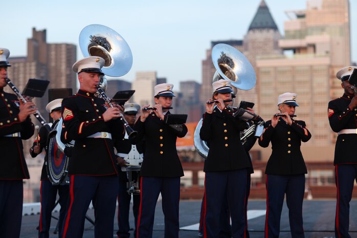 NEW YORK -- Marines from the Marine Forces Reserve Band perform for guests on USS Iwo Jima while docked here, May 30, as part of the Sunset Parade. More than 3,000 Marines, Sailors and Coast Guardsmen in the area participating in community outreach events and equipment demonstrations as part of Fleet Week New York 2011. This is the 27th year New York has hosted the sea services for Fleet Week. (Official Marine Corps photo by Sgt. Jimmy D. Shea / RELEASED)