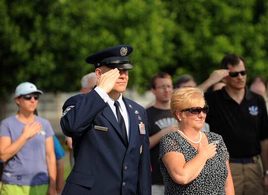 Chief Master Sgt. of the Air Force James Roy salutes during the playing of the national anthem at a Memorial Day ceremony May 30, 2011, at the Air Force Memorial in Arlington, Va.  The ceremony honored the Airmen who gave their lives in the last year.  Those fallen heroes also were honored by wreaths that were presented by Chief Roy and members of several organizations.  (U.S. Air Force photo/Scott M. Ash)
