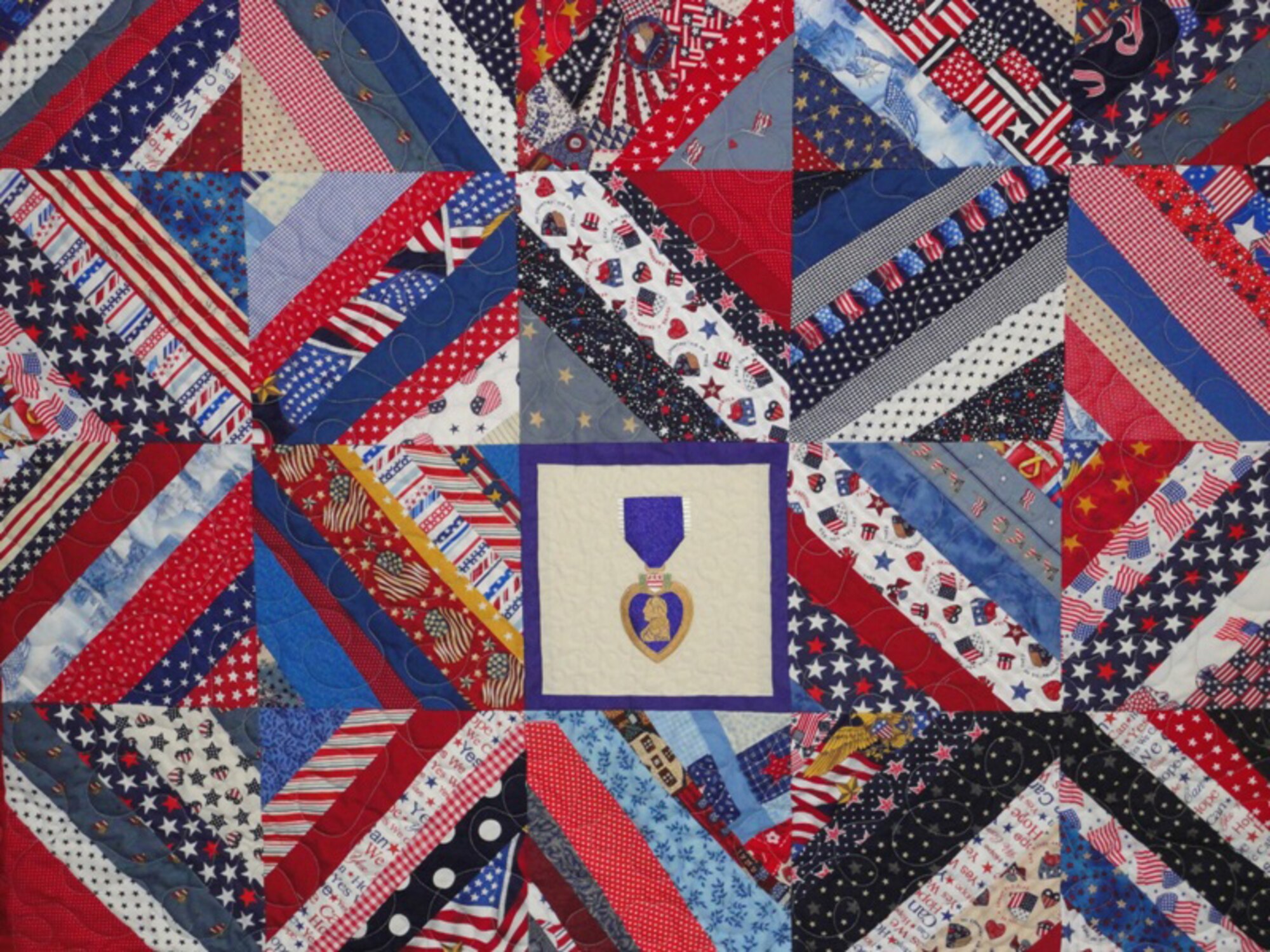 Shortly after the January arrival of the current CASF team, quilts began appearing at the clinic. Wanting to provide something special for the wounded warriors and hoping to provide a touch of home, Jill Shaver, from Murfreesboro, Tenn., began fashioning homemade quilts. (U.S. Air Force courtesy photo)