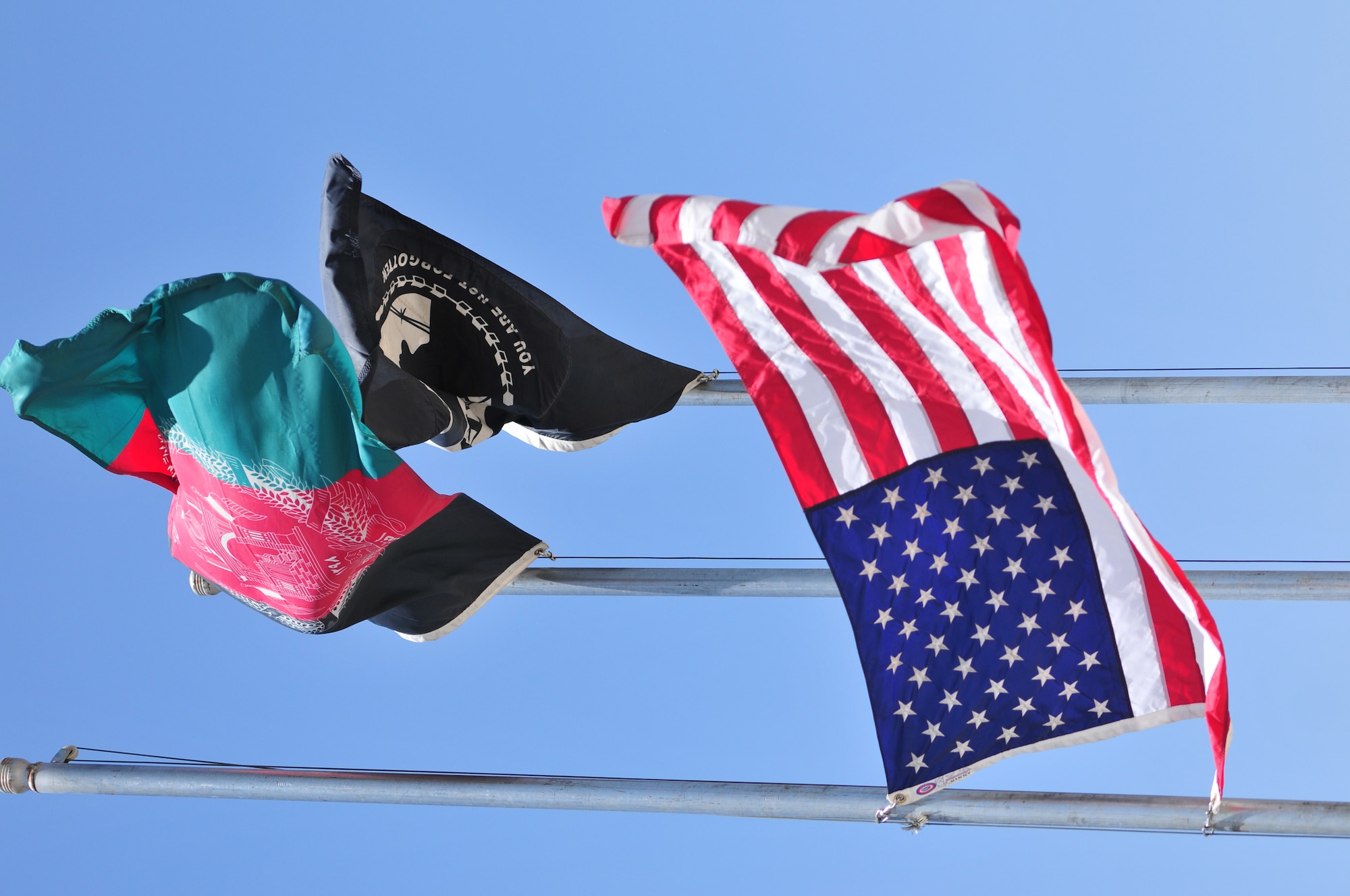 KABUL, Afghanistan - The American flag flys at half staff at the 438th Air Expeditionary Wing during Memorial Day-.  The day serves to honor military members currently serving and those that have died while in military service.  Many Americans observe Memorial day by visiting cemeteries and memorials with the U.S. flag usually flying at half staff.  (US Air Force Photo by Tech. Sgt. Brian E. Christiansen)