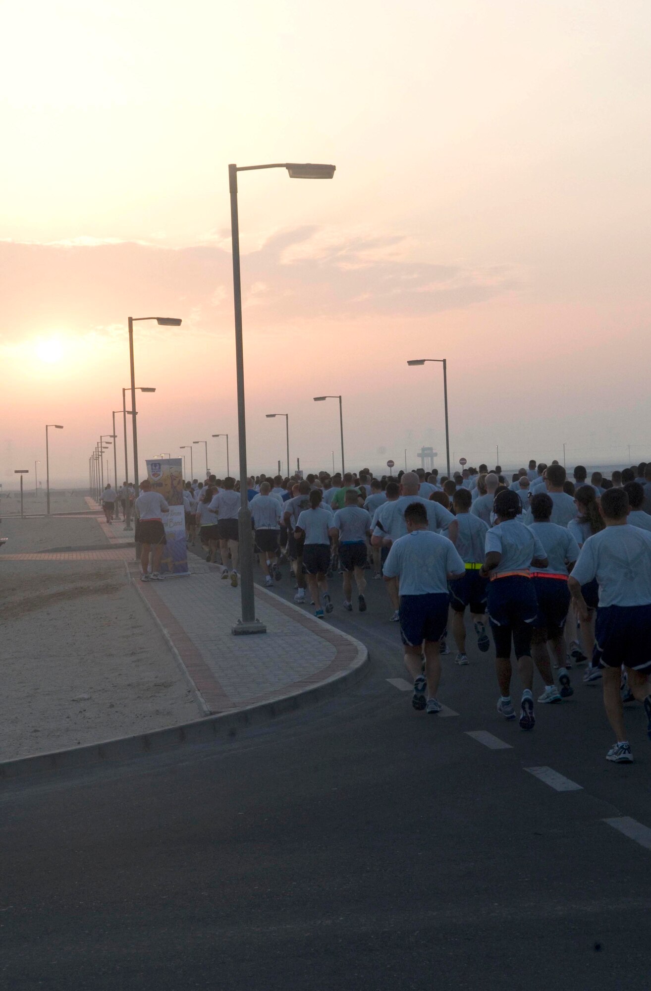 U.S. and coalition service members participate in the Bolder Boulder 10K May 30 in Southwest Asia. (U.S. Air Force photo/Staff Sgt. Anthony Graham)