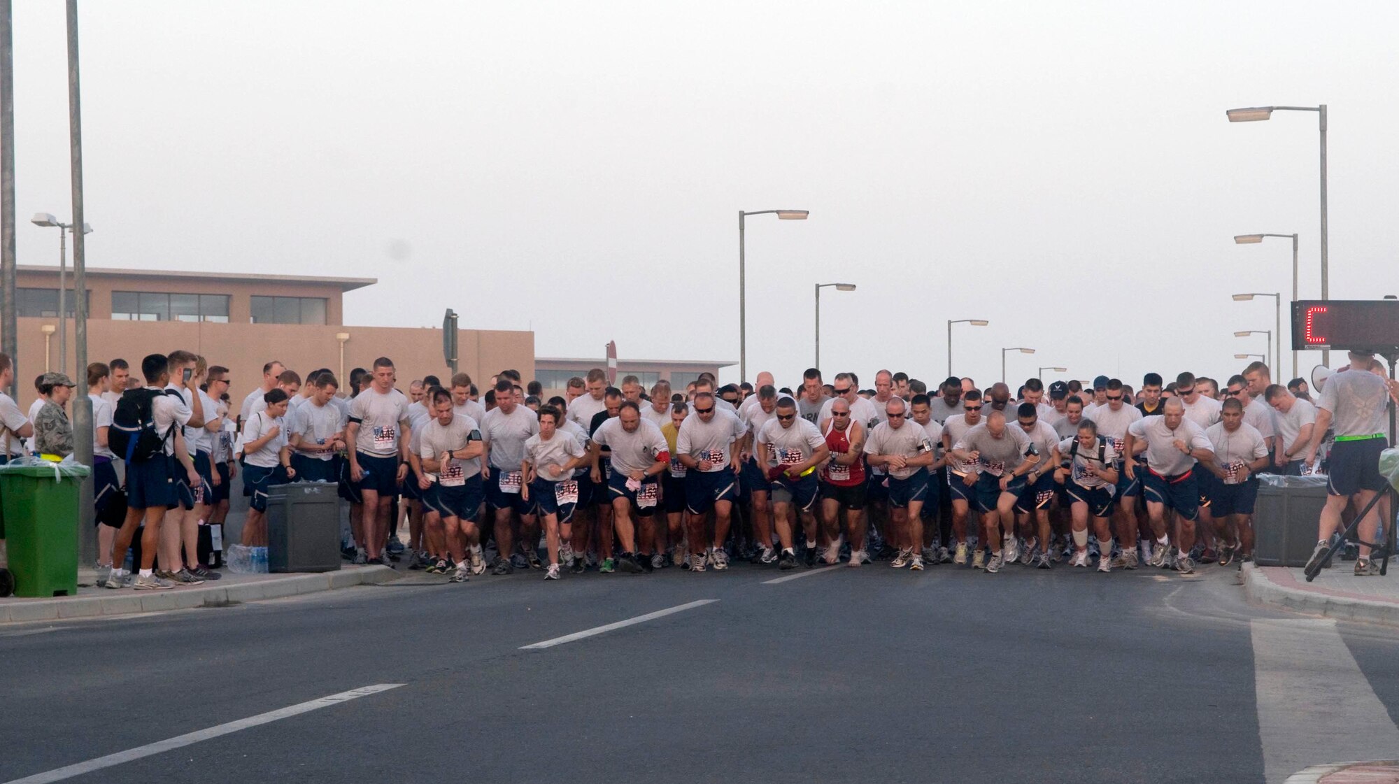 Deployed U.S. and coalition servicemembers take off from the starting line during the Bolder Boulder 10K run May 30 in Southwest Asia.  (U.S. Air Force photo/Staff Sgt. Anthony Graham)