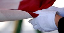 Airmen from the Ellsworth Air Force Base, S.D. Honor Guard fold a U.S. flag during a funeral at the Nebraska Veterans Cemetery, Alliance, Neb., May 27, 2011. The funeral was in honor of 1st Lt. Clark Kooper, a U.S. Army Air Force pilot, shot down during World War II. (U.S. Air Force photo by Senior Airman Jarad A. Denton)