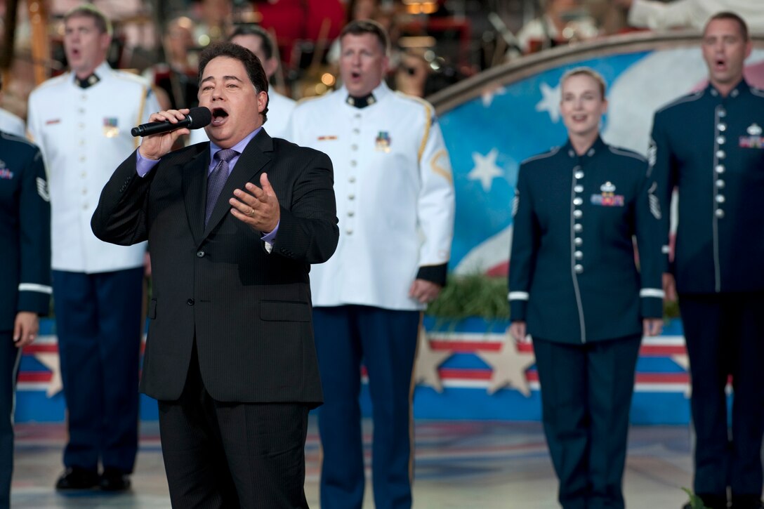 Former New York City police officer Daniel Rodriguez sings "God Bless America" during the 2011 National Memorial Day Concert at the U.S. Capitol in Washington, D.C., May 29, 2011.