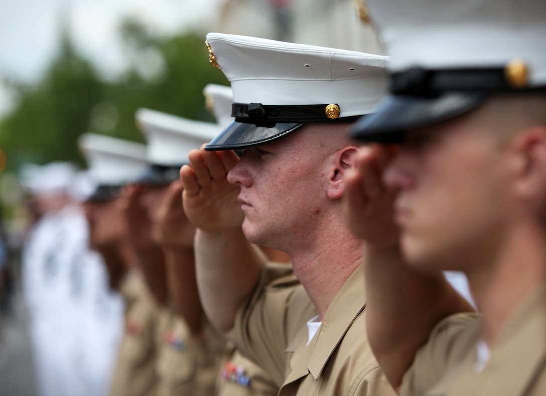 Marines with the 24th Marine Expeditionary Unit, participate in a Memorial Day parade at Glendale N.Y. May 30, 2011. Various units from II Marine Expeditionary Force and Marine Forces Reserve have organized under the 24th MEU to form the to form the Special Purpose Marine Air Ground Task Force - New York. The Marines embarked on the Navy's Amphibious Assault Ships, the USS Iwo Jima (LHD -7) and USS New York (LPD-21) to take part in Fleet Week New York 2011 from May 25 to June 1. The Marines will showcase the capabilities of the MAGTF, and also honor those who have served by participating in various events during the Memorial Day weekend.