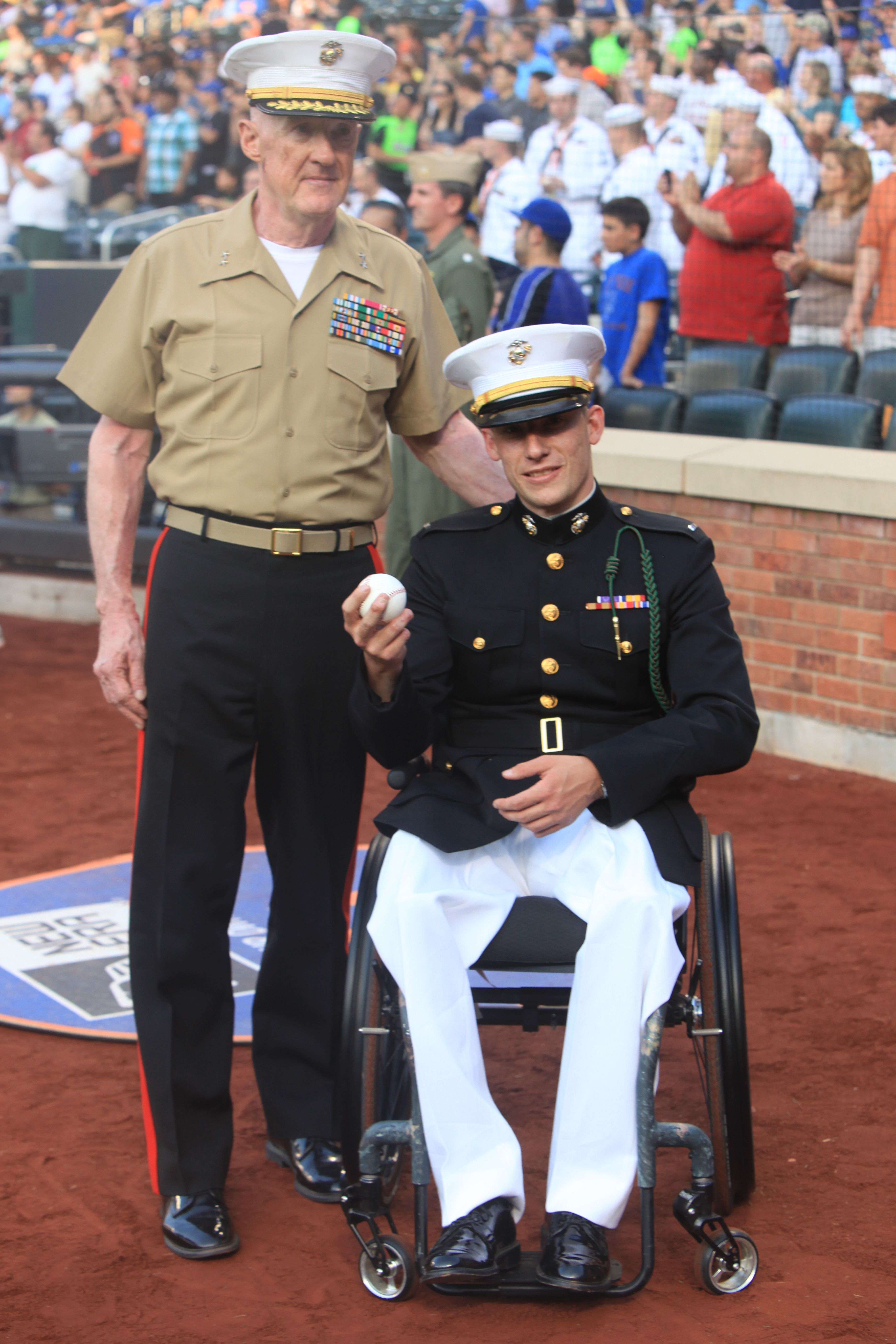 Major Gen. Richard Mills, I Marine Expeditionary Force Commanding General, and 1st Lt. Matthew A. Krempel, pose for a photo after the ceremonial first pitch at a New York Mets game, May 30, 2011. Various units from II Marine Expeditionary Force and Marines Forces Reserve have organized under the 24th Marine Expeditionary Unit to form the Special Purpose Marine Air Ground Task Force - New York. The Marines are embarking on the Navy’s Amphibious Assault Ships, the USS Iwo Jima (LHD -7) and USS New York (LPD-21) to take part in New York City's Fleet Week from May 25 to June 1, 2011. There, the Marines will showcase the capabilities of the MAGTF, and also honor those who have served by participating in a various of events during the Memorial Day weekend.