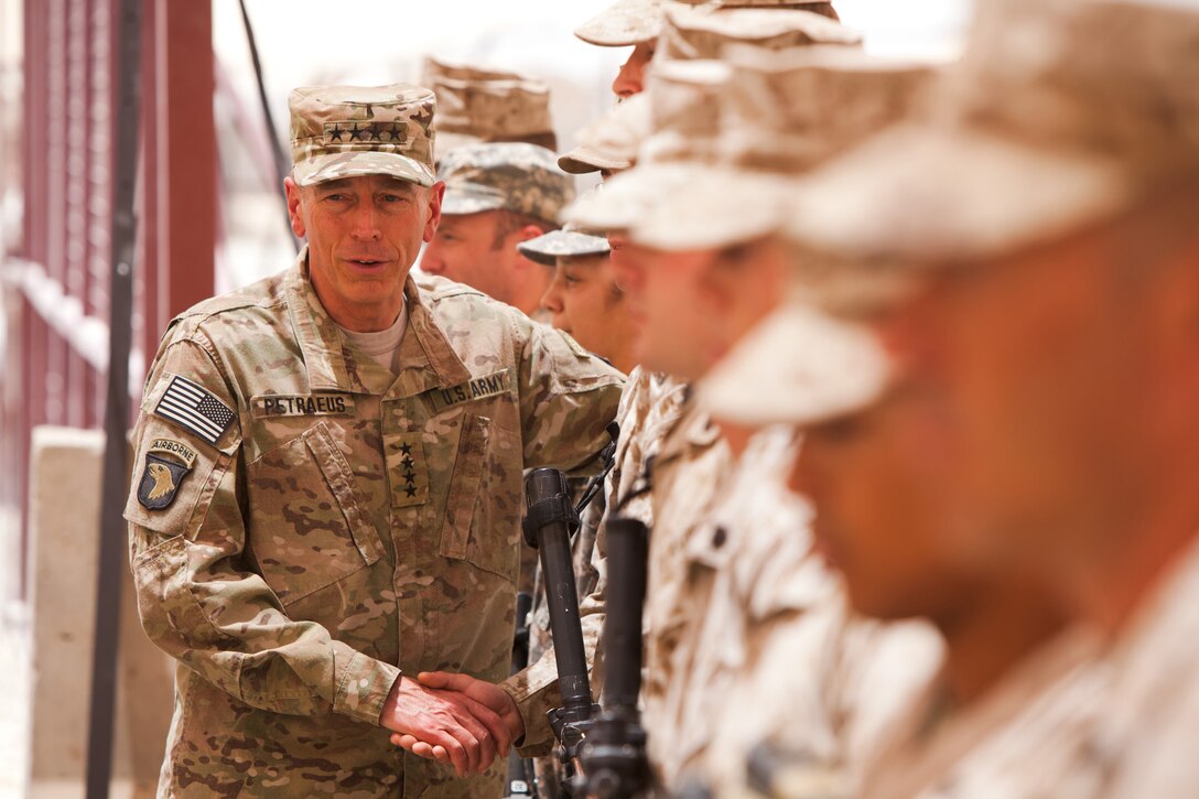 Gen. David Petraeus, the commanding general of International Security Assistance Force, greets Marines and Sailors with Regimental Combat Team 1, at the RCT-1 headquarters here, May 30. Petraeus visited Camp Dwyer to evaluate coalition progress in Southern Helmand province.