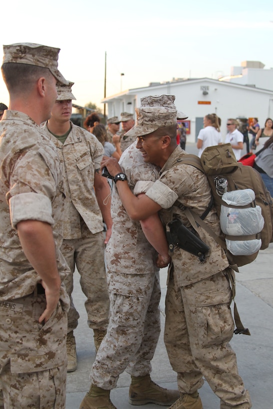 Marines from 3rd Light Vehicle Reconnaissance Battalion are welcomed home by Marines from the remain behind element at the battalion's motor transport lot June 1, 2011. The battalion returned to the Combat Center after a seven-month-long deployment to Afghanistan.