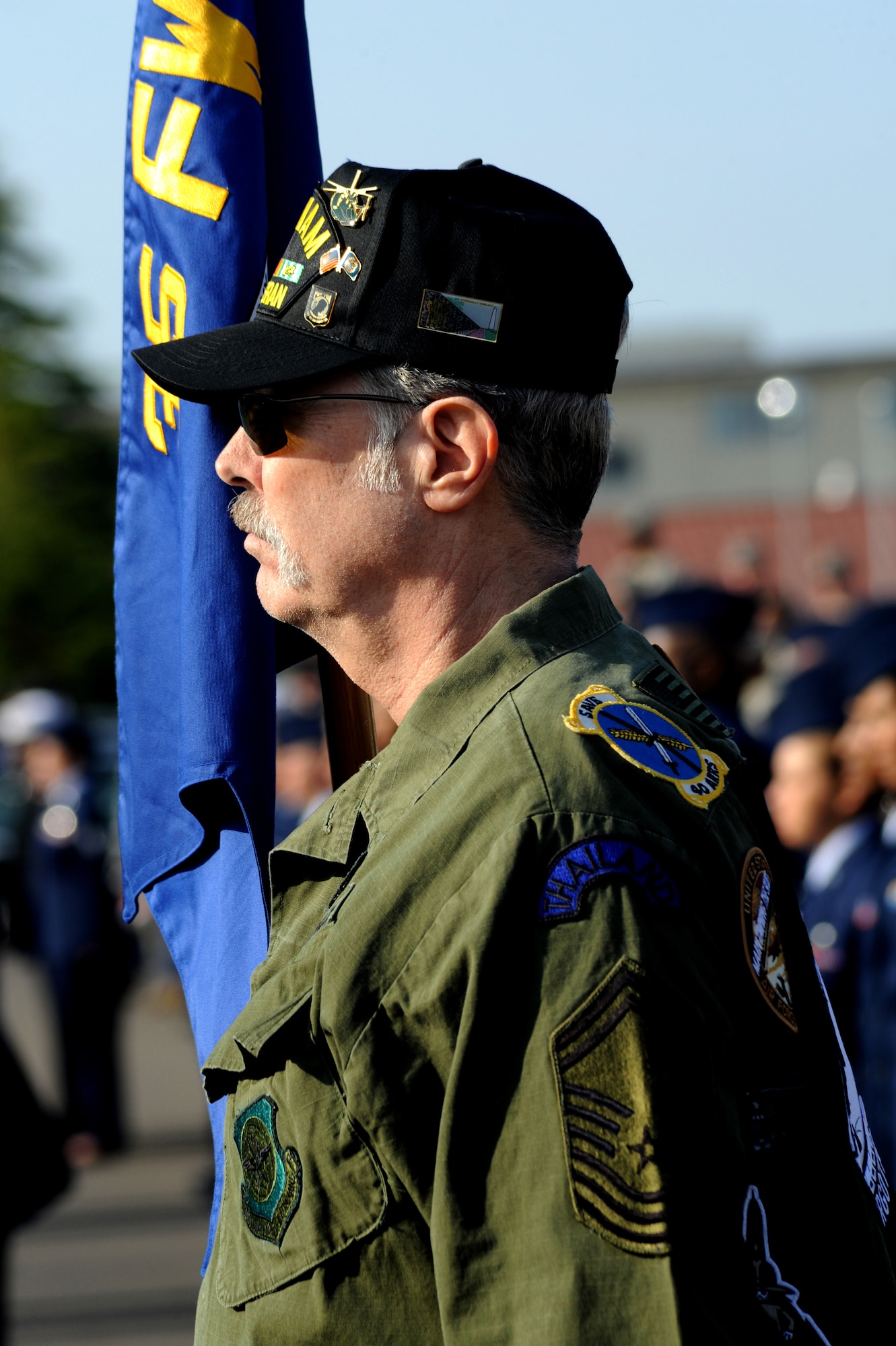 MISAWA AIR BASE, Japan -- Retired Chief Master Sgt. Dave Barton holds the guidon for the retiree formation during the Memorial Day ceremony May 26.  This federal holiday is a time for remembrance of the fallen service members who gave their lives for their country.  (U.S. Air Force Photo/Staff Sgt. April Quintanilla)
