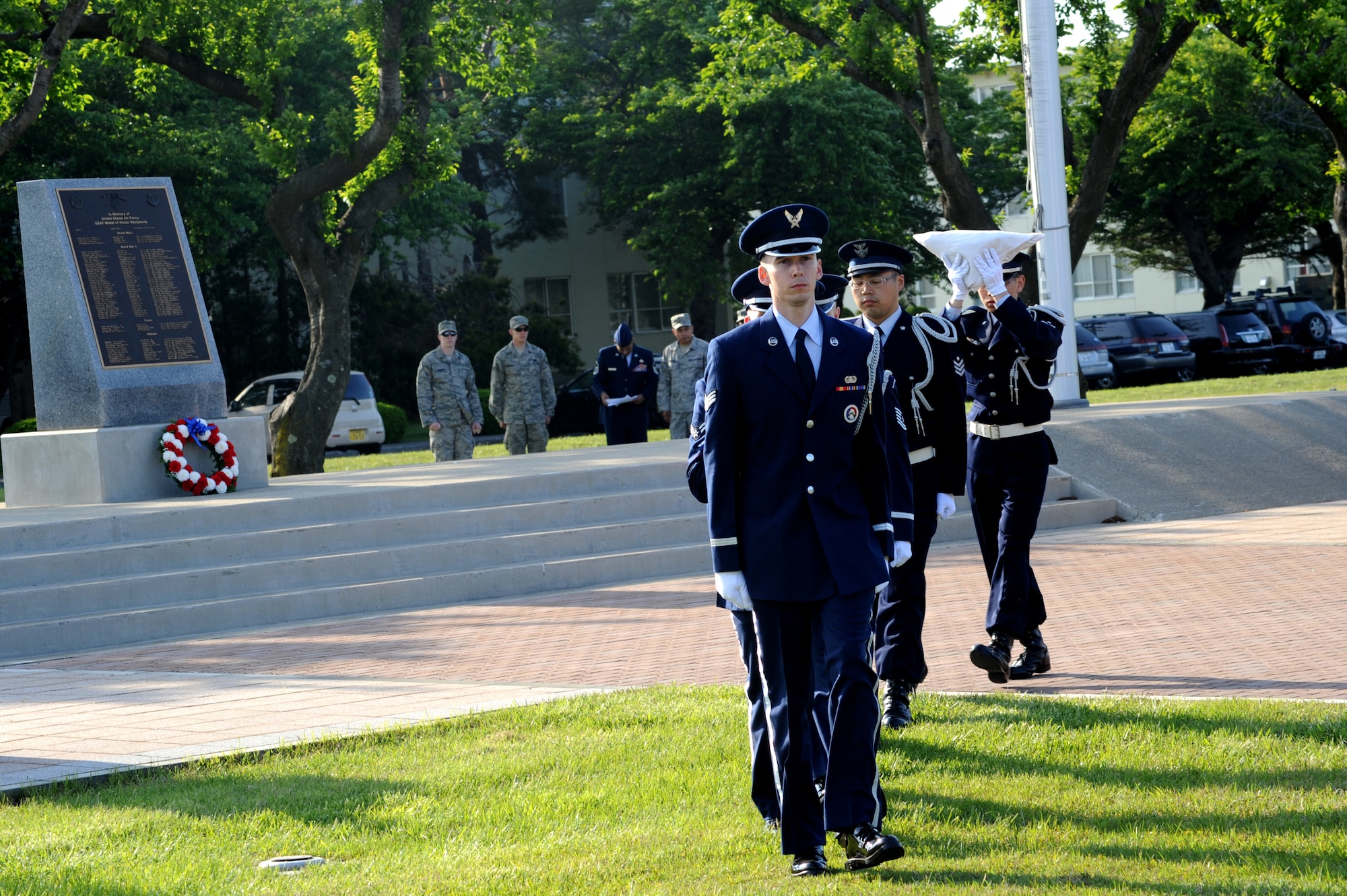 MISAWA AIR BASE, Japan -- The Misawa Air Base Honor Guard and the Japan Air Self-Defense Force retire the flags, concluding the Memorial Day ceremony May 26.  Observed on the last Monday of May, the federal holiday is a chance for people to remember those individuals who have passed on. (U.S. Air Force Photo/Staff Sgt. April Quintanilla)