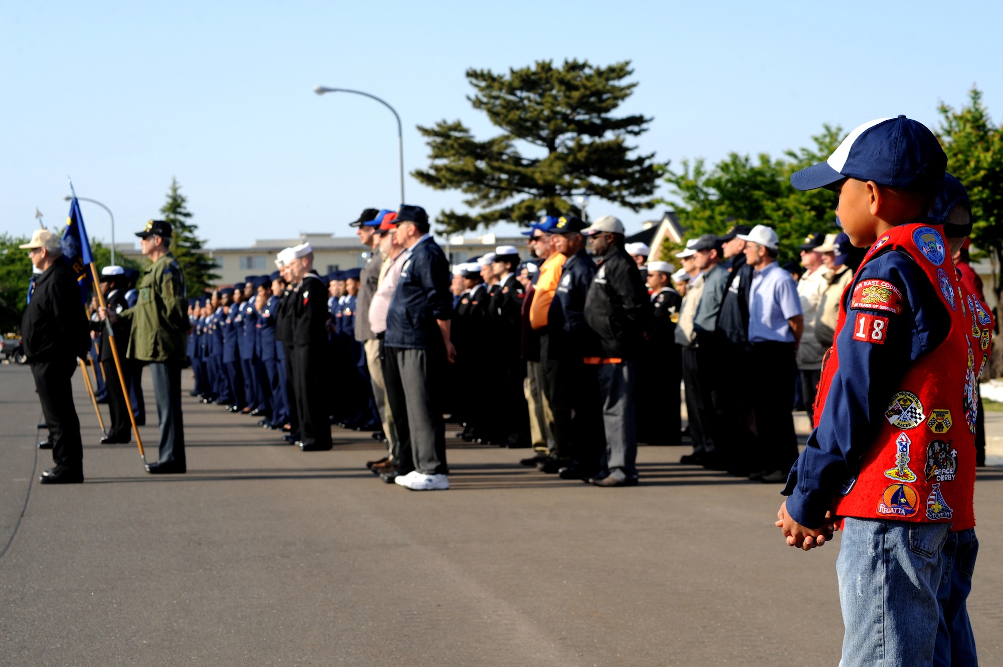 MISAWA AIR BASE, Japan -- Cub Scout Joshua Vanover, 9, son of U.S. Navy Master Chief Petty Officer Danielle Gunsett, Personnel Support Detachment officer in charge, watches the Memorial Day formation May 26.  The Memorial Day ceremony is a time for members of all services to honor those who have given their lives in defense of the United States.   (U.S. Air Force Photo/Staff Sgt. April Quintanilla)