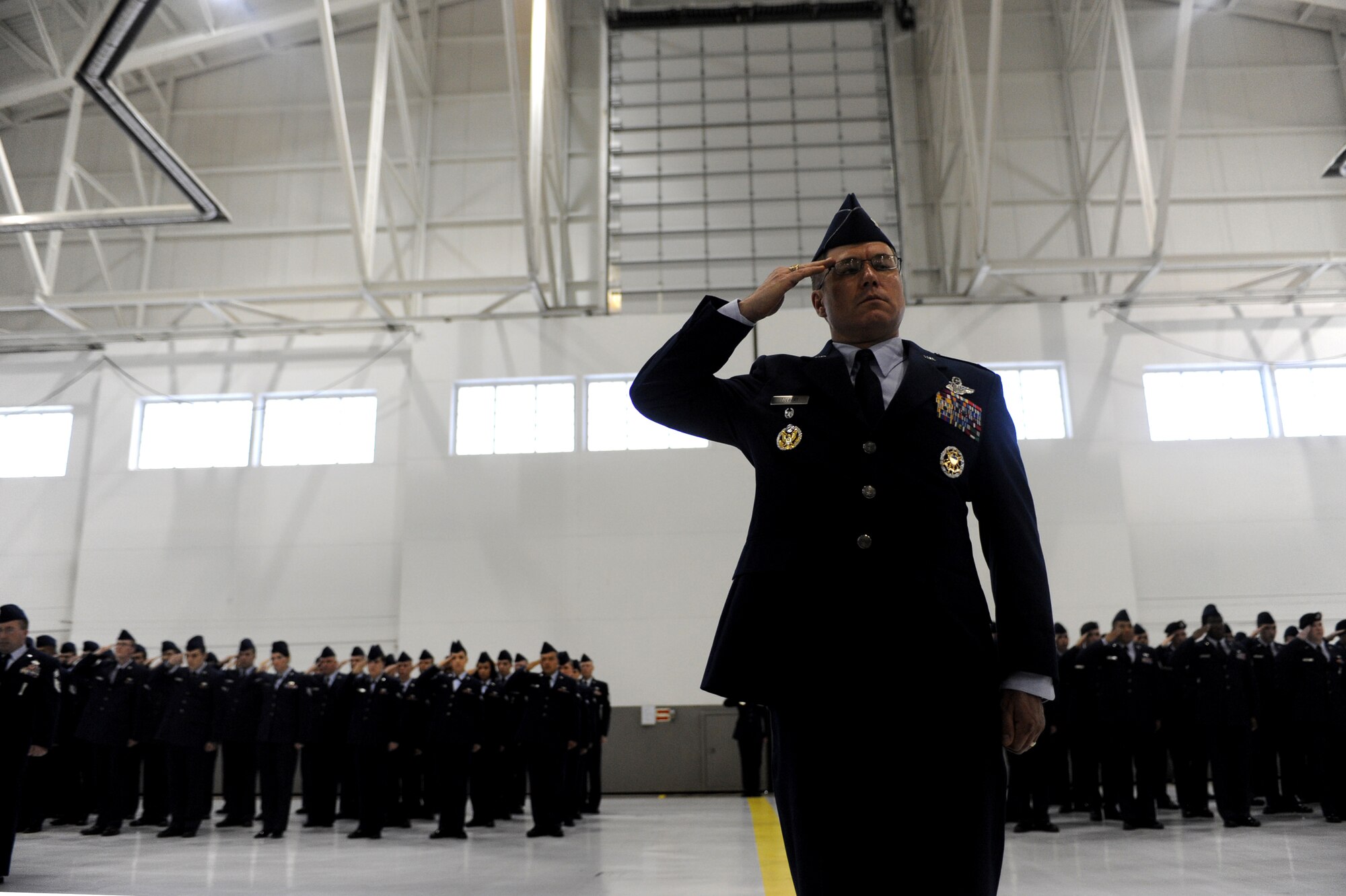 MINOT AIR FORCE BASE, N.D. -- Col. Julian Tolbert, 5th Bomb Wing vice commander, leads the troop formation in a ceremonial salute to Col. James Dawkins here May 31. Colonel Dawkins will lead as the 51st commander of the 5th Bomb Wing “Warbirds.” The change of command ceremony is one of the Air Force’s time-honored traditions. (U.S. Air Force photo/Airman 1st Class Aaron-Forrest Wainwright)