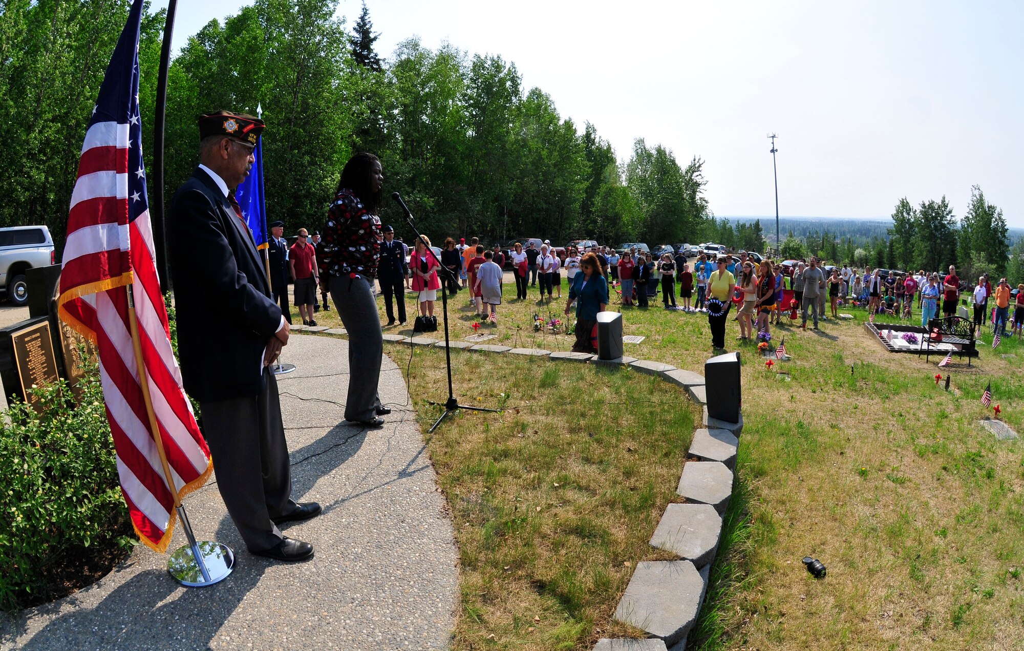 Willa Henderson sings during the placement of the wreaths during a Memorial Day ceremony at Birch Hill Cemetery May 30, 2011, Fairbanks, Alaska.   The American Legion Post 30 held services throughout Fairbanks in honor of all men and women who served in the U.S. Armed Forces.  (U.S. Air Force photo/Staff Sgt. Miguel Lara III)
