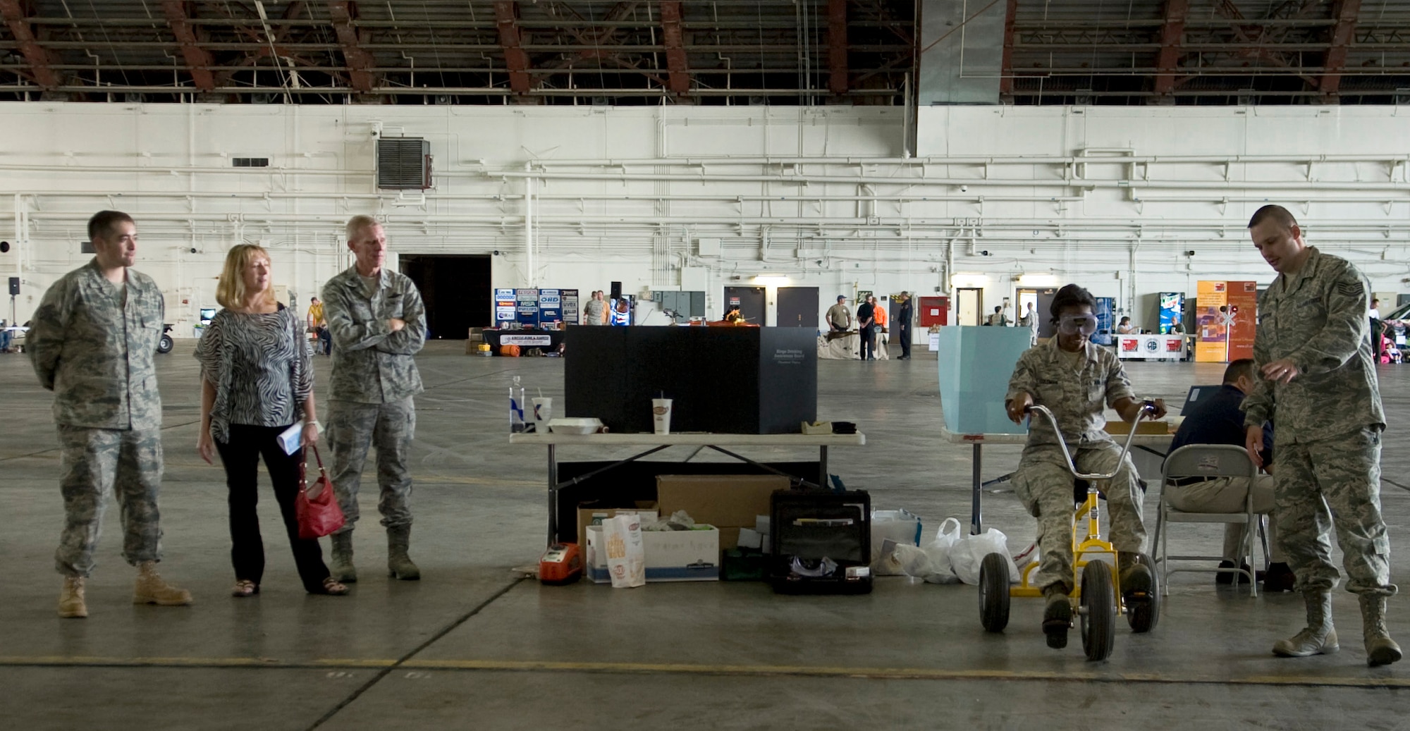 Airmen experience the dangers of driving under the influence during the annual summer safety fair May 26, 2011, Eielson Air Force Base, Alaska. Airmen assigned to the Alcohol and Drug Abuse Prevention and Treatment program provided fatal vision goggles to simulate driving under the influence on a closed course. (U.S. Air Force photo/Airman 1st Class Laura Goodgame) 