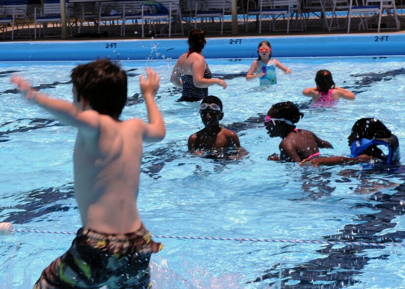 Barksdale residents enjoy a day at the North Pool on Barksdale Air Force Base, La., May 31. More than 40 people came out to swim and sunbathe during open swim time. For more information on swim lessons, pool parties, lap swim and open swim times, call 456-3482 or 456-3389. (U.S. Air Force photo/Senior Airman La'Shanette V. Garrett) (RELEASED)