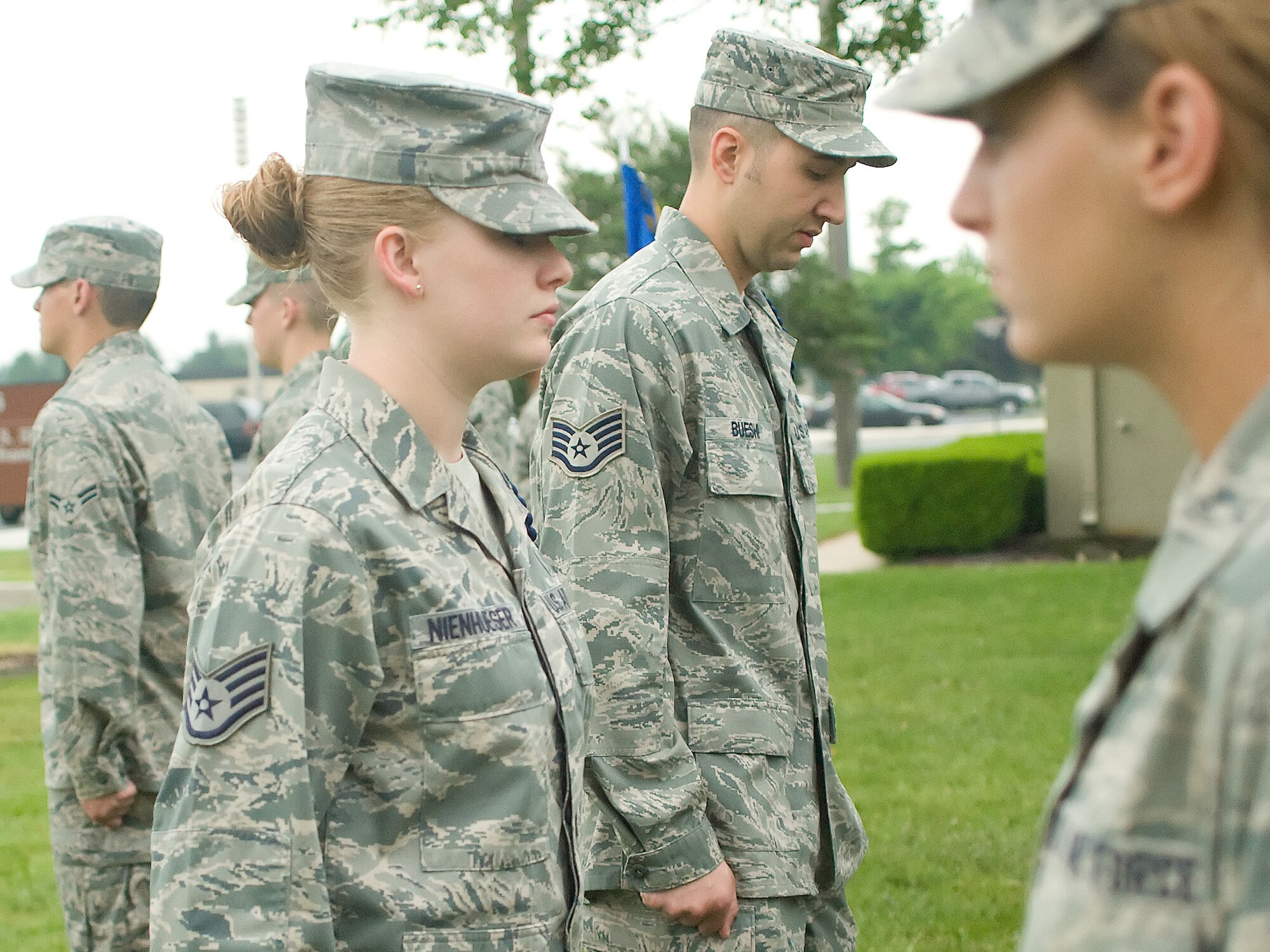 Staff Sgt. Jessica Nienhueser (left) and Staff Sgt. Ali Bueshi, 373rd Training Squadron military training leaders, inspect Det. 3 Airmen's appearances May 24, 2011, at Dover Air Force Base, Del. The MTLs assure that Airmen in technical training retain the standards and discipline taught to them during basic military training. (U.S. Air Force photo/Adrian Rowan)