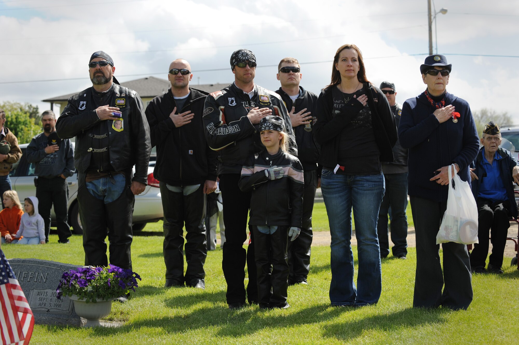 MOUNTAIN HOME, Idaho – Members of the local community honor the timeless tradition of placing their hands over their hearts during the national anthem at a Memorial Day ceremony at Mountain View Cemetery here May 30. (U.S. Air Force photo by Staff Sgt. Gina Chiaverotti-Paige) 